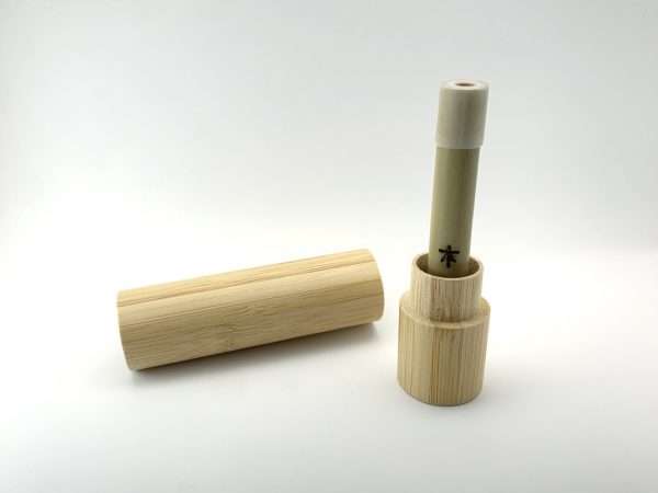 Dynaboo ~ Aquaboo Dry Herb Vape standing in magnetic lid of stash tube